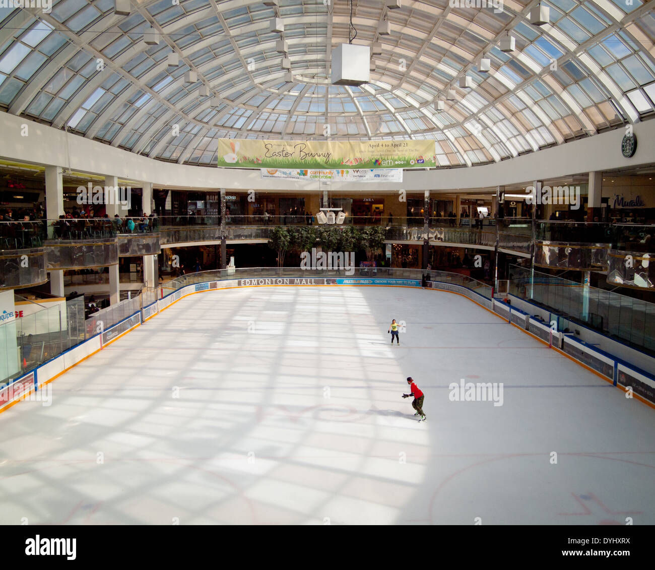 A couple of figure skaters practice at the Ice Palace skating rink at West Edmonton Mall in Edmonton, Alberta, Canada. Stock Photo