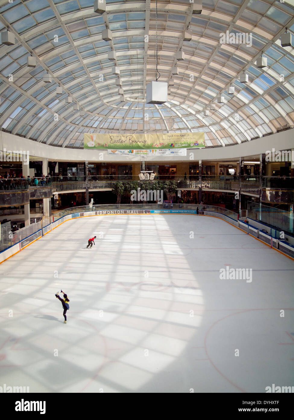 A couple of figure skaters practice at the Ice Palace skating rink at West Edmonton Mall in Edmonton, Alberta, Canada. Stock Photo