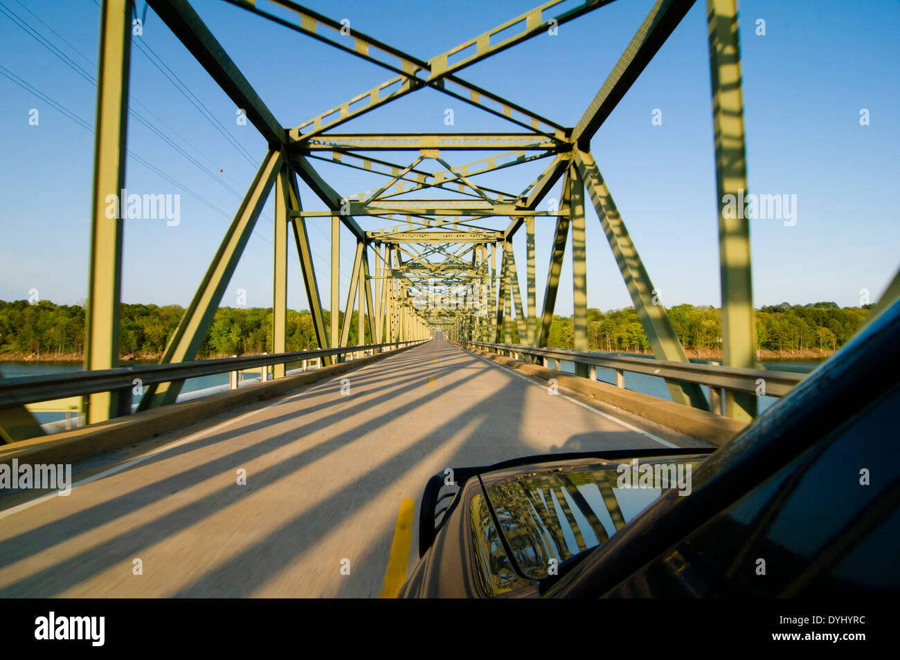 SUV vehicle driving across the Narrows Bridge on Greers Ferry Lake in Greers Ferry, Arkansas Stock Photo