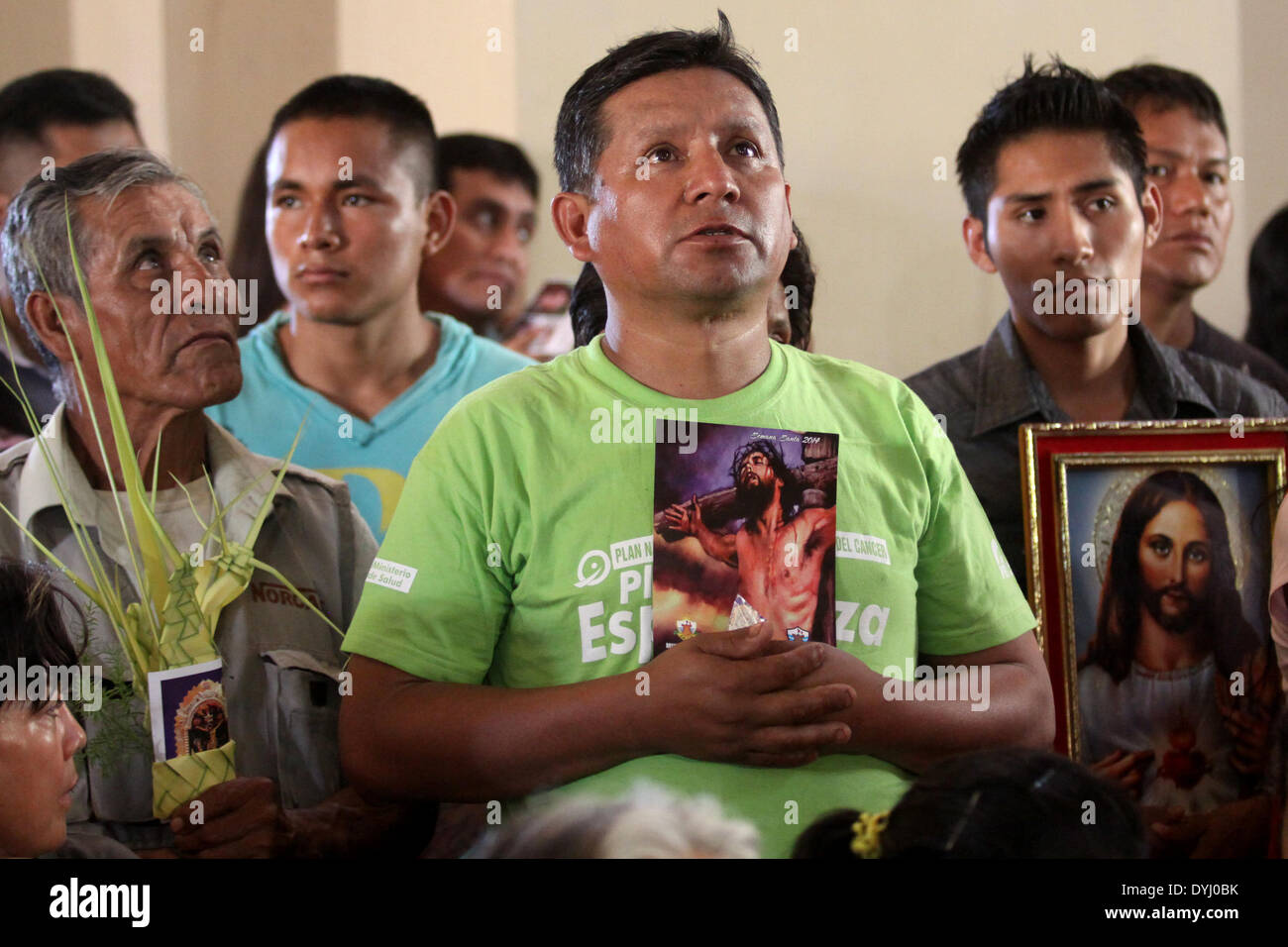Lima, Peru. 18th Apr, 2014. Locals participate in a mass, after the arrival of the procession of the Lord of the Miracles, during the commemoration of Good Friday, in Lima's Cathedral, Peru, on April 18, 2014. © Melina Mejia/Andina/Xinhua/Alamy Live News Stock Photo
