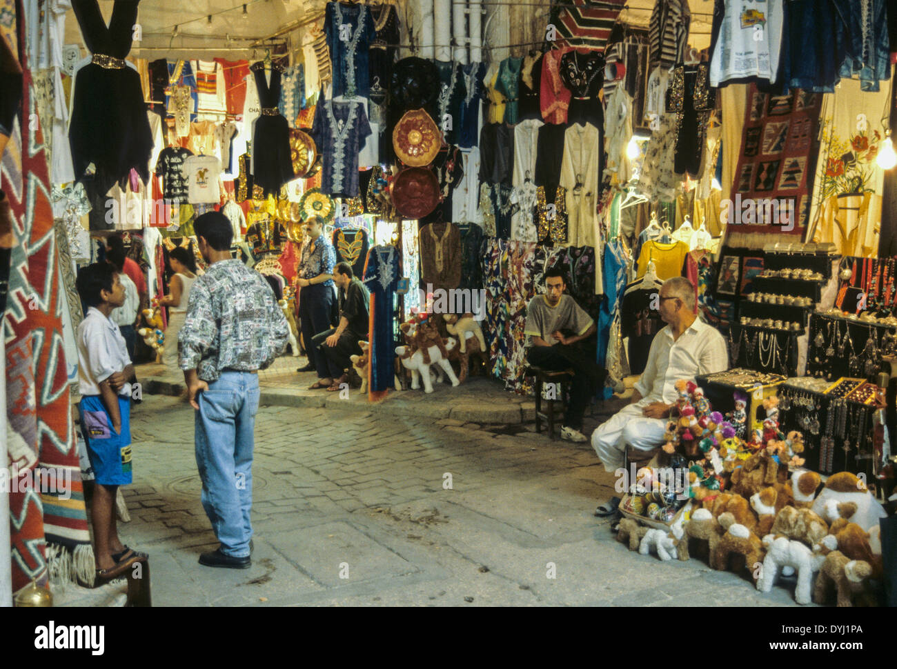 Tunisia. Tunis Medina. Souk. Clothing, Stuffed Animals, Hassocks. Stock Photo