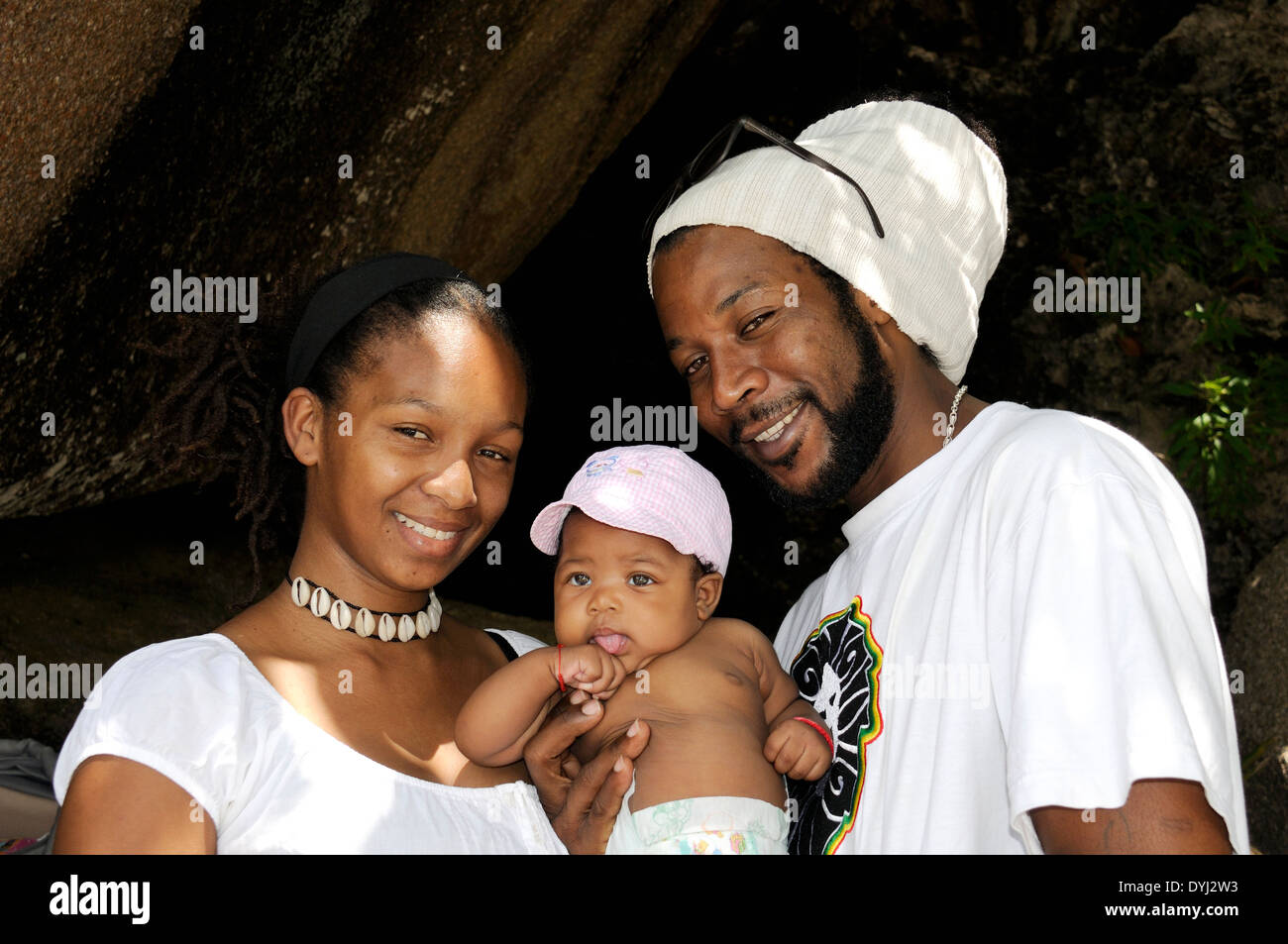 Seychellois Husband, Wife, and Baby Together at La Digue, Seychelles Stock Photo