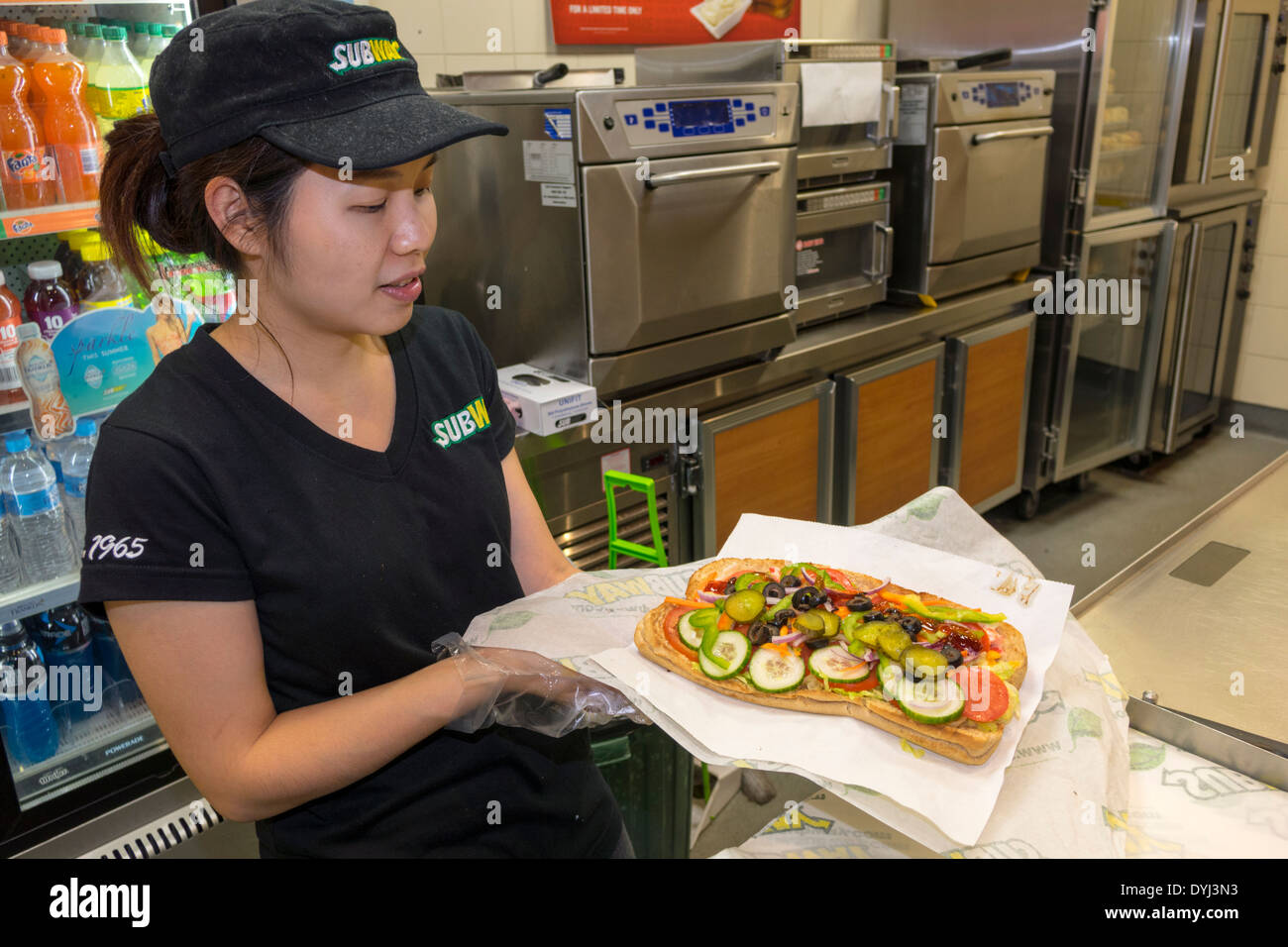 Sydney Australia,subway,train,sandwich shop,restaurant restaurants food dining cafe cafes,Asian woman female women,work,employee employees worker work Stock Photo