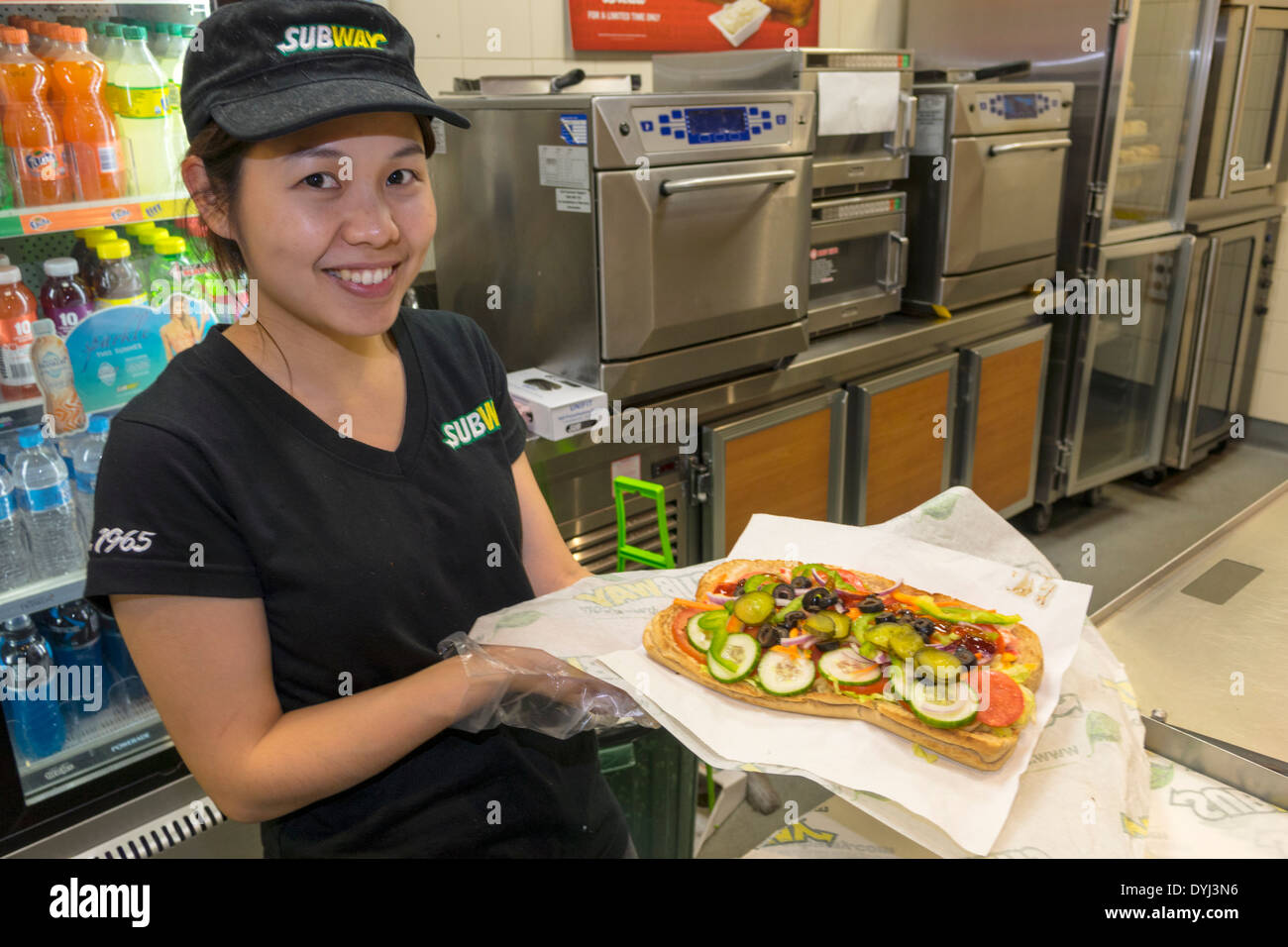Sydney Australia,subway,train,sandwich shop,restaurant restaurants food dining cafe cafes,Asian woman female women,work,employee worker workers workin Stock Photo