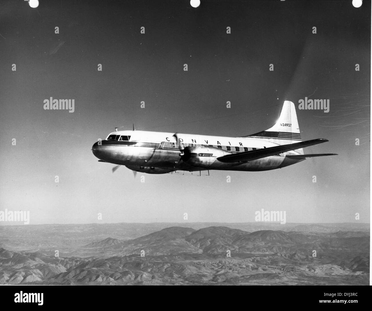 This photo features the Convair 240, a twin-engine, short- to medium-range airliner developed in the late 1940s. The aircraft depicted in the image, N24927, is part of the A-1443 model series. Stock Photo