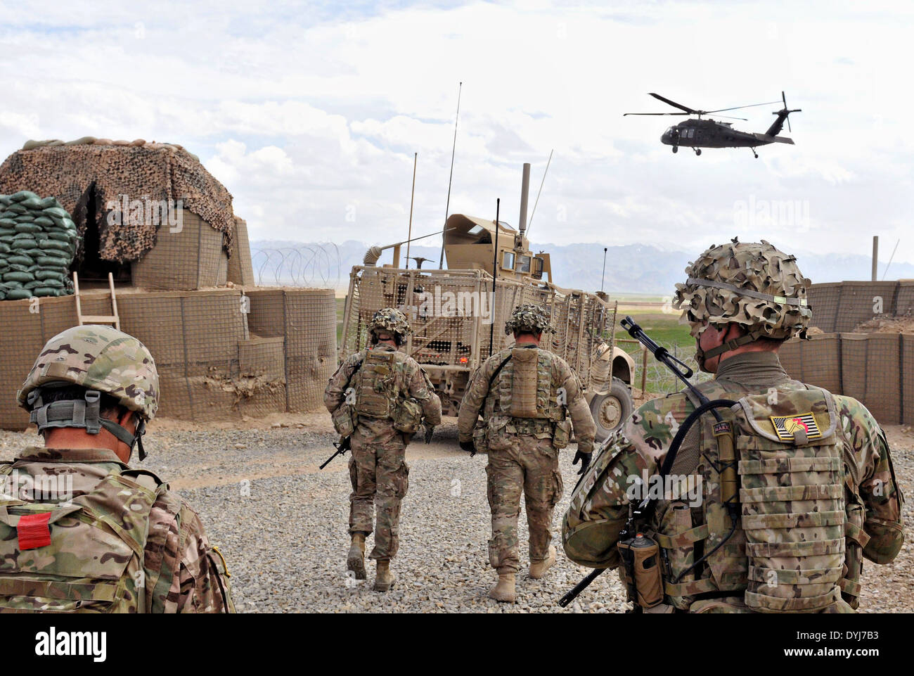 US Army soldiers walk toward the UH-60 Black Hawk during a visitation ...