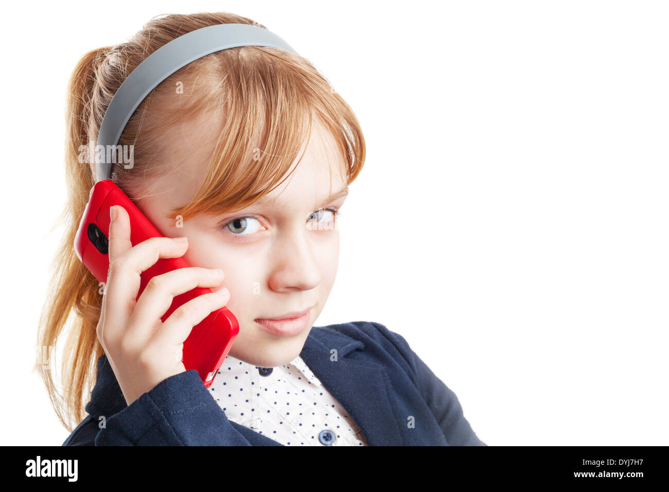 Blond Caucasian schoolgirl calling by mobile phone. Portrait isolated on white Stock Photo