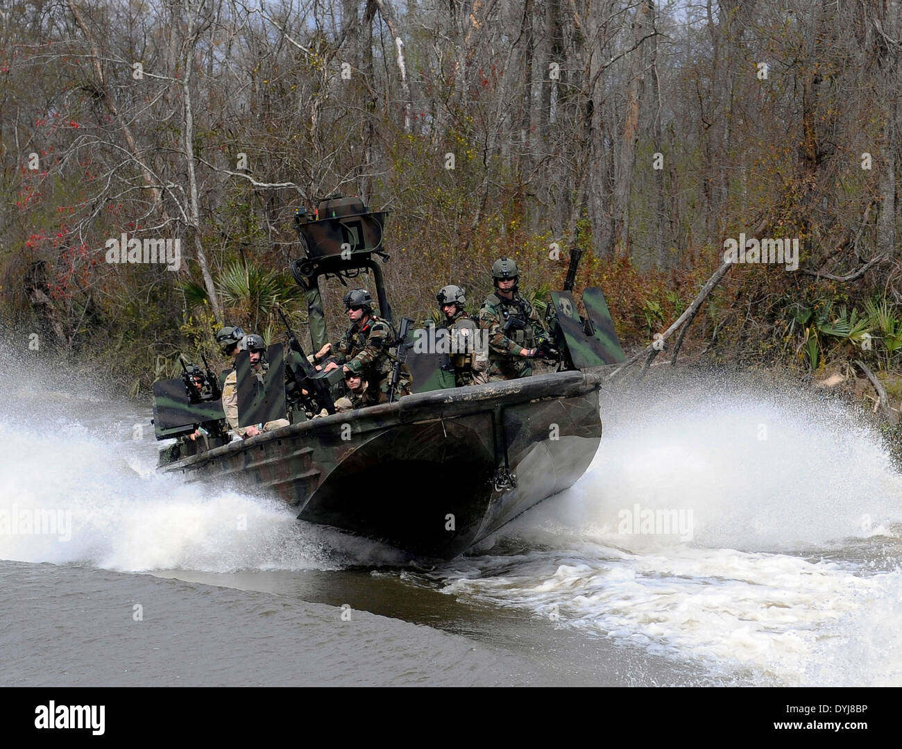 US Navy SEAL Special Warfare Combatant craft Crewmen assigned to Special Boat Team 22 conduct live-fire drills at the riverine training range along the Pearl River March 4, 2009 at the John C. Stennis Space Center, Mississippi. Stock Photo