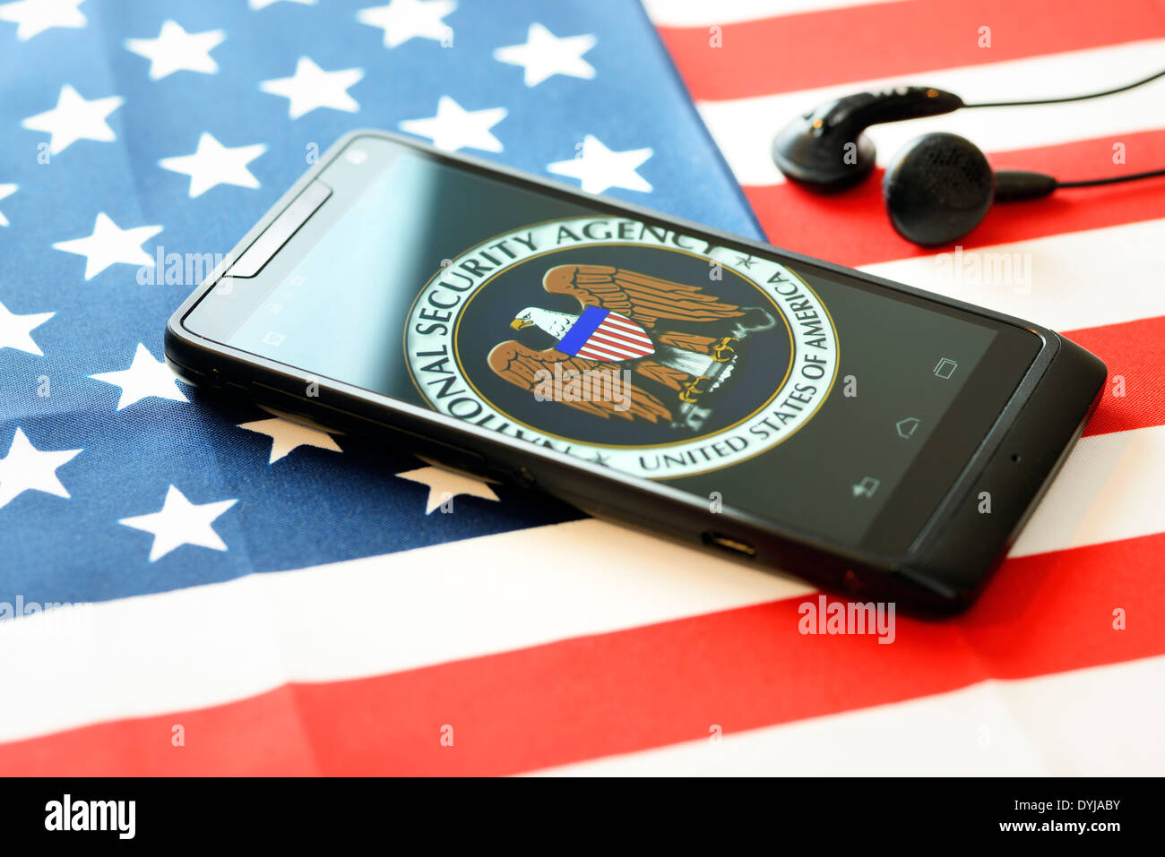 Phone with NSA logo on U.S. flag, listening affair, Handy mit NSA-Logo auf US-Fahne, Abhöraffäre Stock Photo