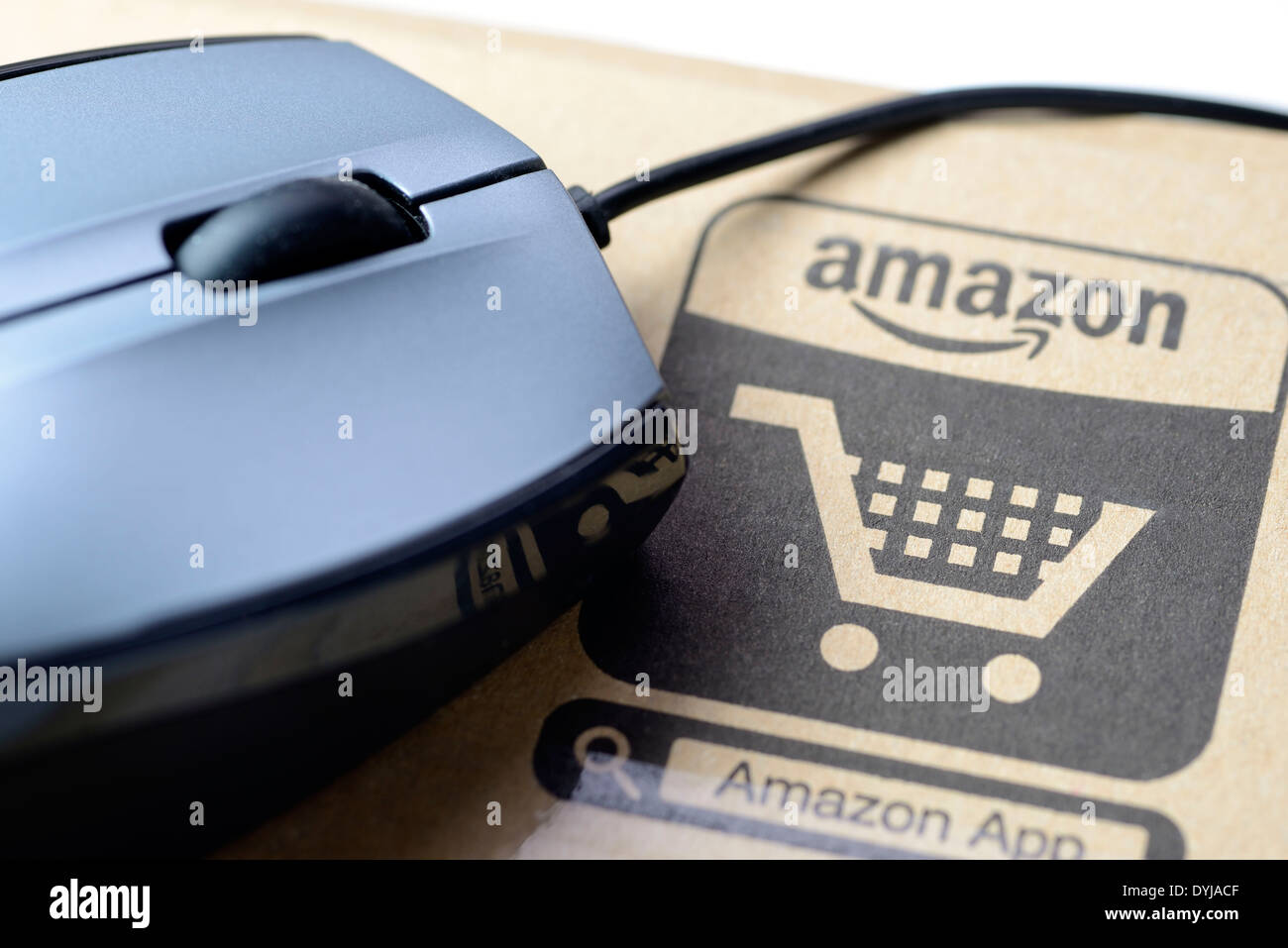 Amazon packaging with shopping cart, Amazon-Verpackung und Computermouse Stock Photo