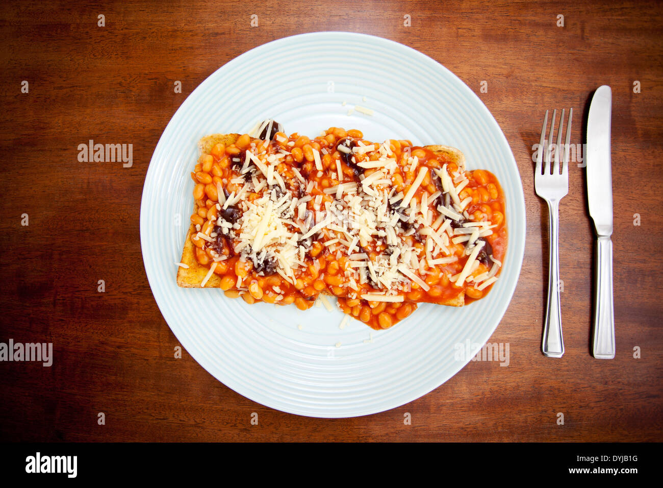 Beans on toast with cheese Stock Photo Alamy