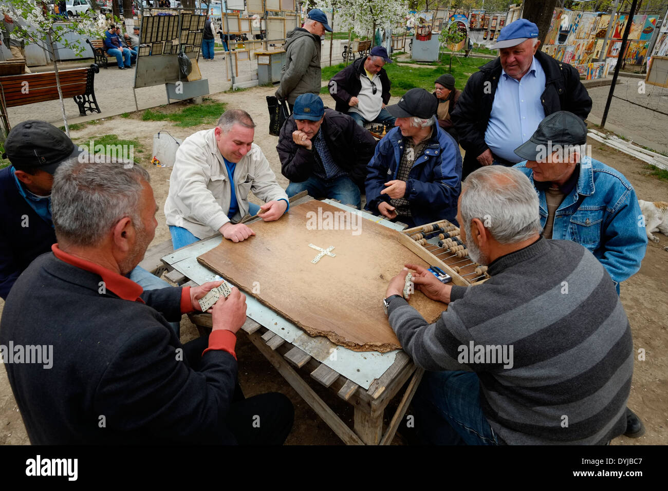 Georgian men playing Domino game at the 'Dry Bridge Bazaar' Flea market in Tbilisi capital of the Republic of Georgia Stock Photo
