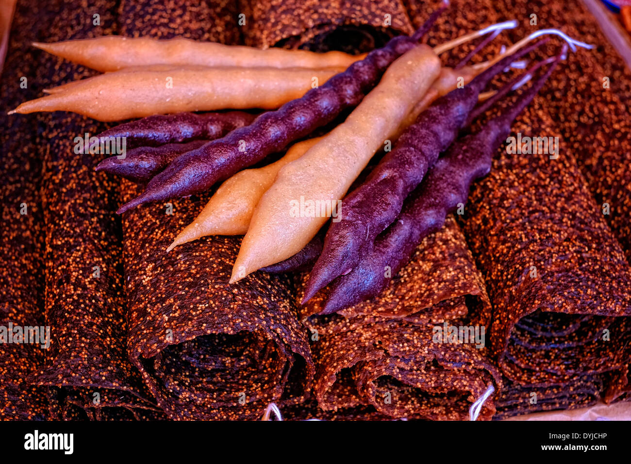 Traditional Churchkhela sausage-shaped candies and sweet food called Tklapi also known as 'fruit leather' in Georgia Stock Photo