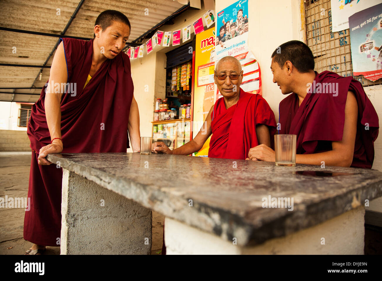 Monks having masala tea at a local tea shop in Bylakuppe, India. Stock Photo