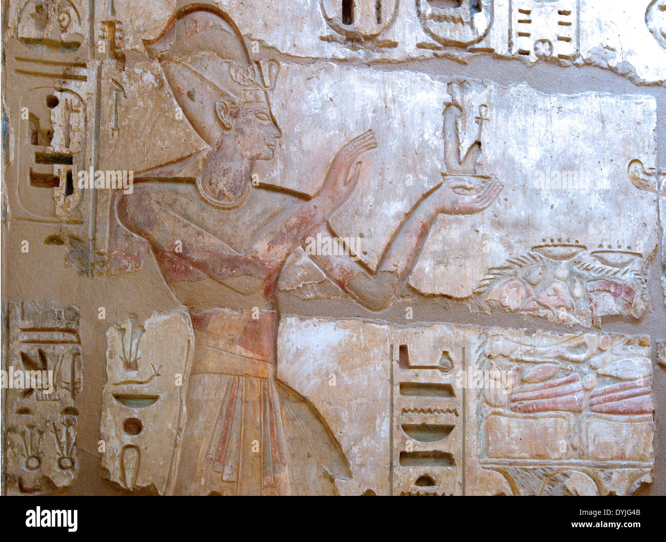 Temple of Ramses III at Medinet Habu:the king offering a statue of ...