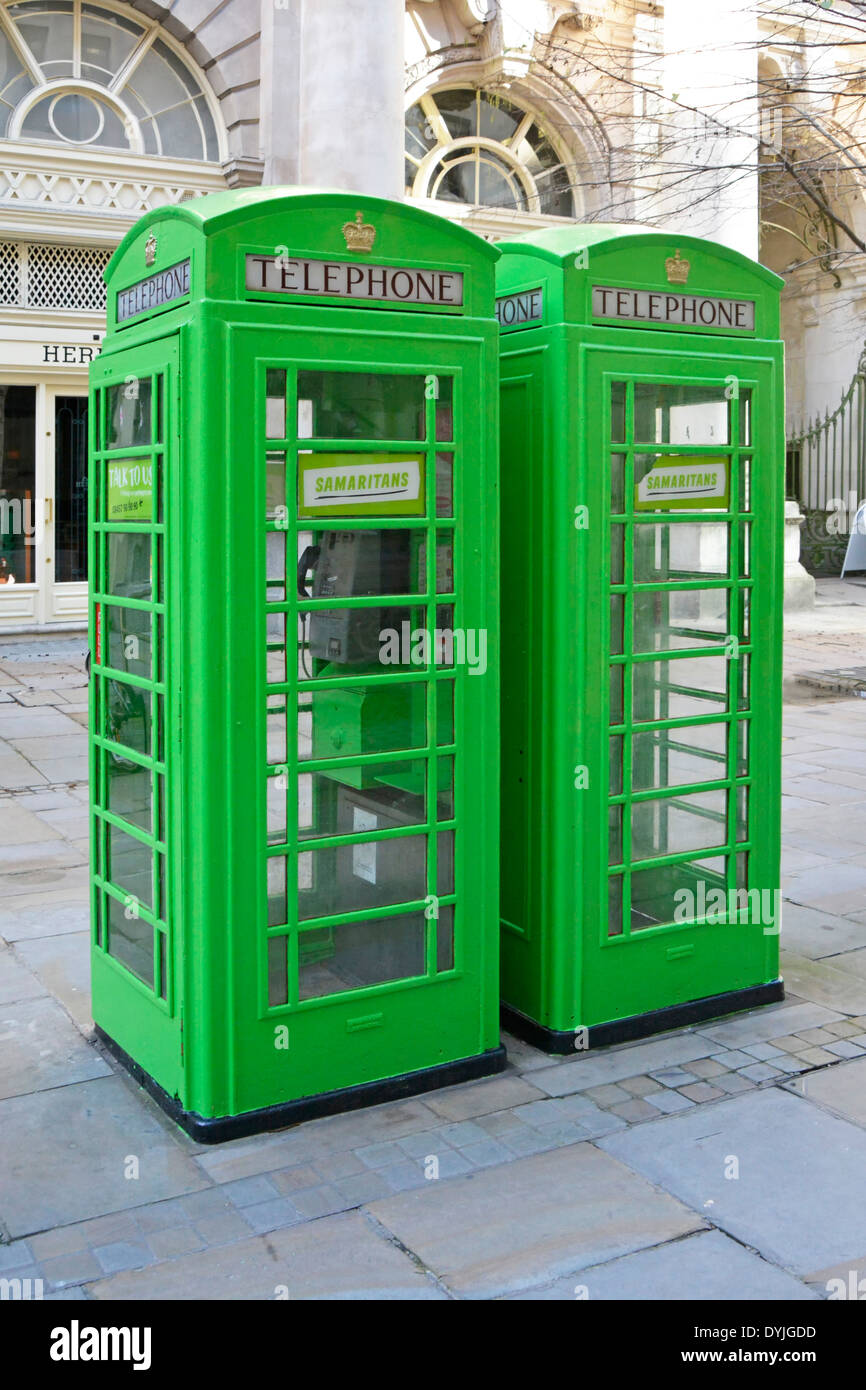 Standard telephone boxes painted in Samaritans green in celebration of the charities 60th year Stock Photo