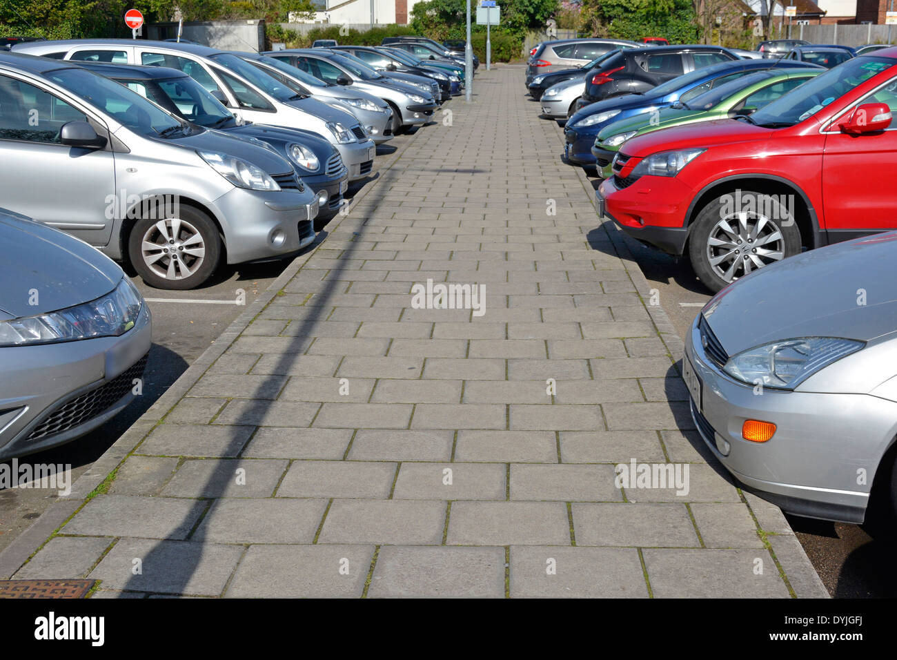 Basildon Council operated pay & display shoppers car park behind Billericay Essex shopping High Street cars in parking bays beside path England UK Stock Photo
