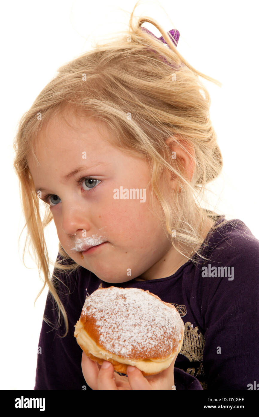 Kind im Fasching mit Krapfen. Faschingskrapfen / Children in carnival with donuts. Carnival doughnut, Blondes Maedchen, 7 Jahre; Stock Photo