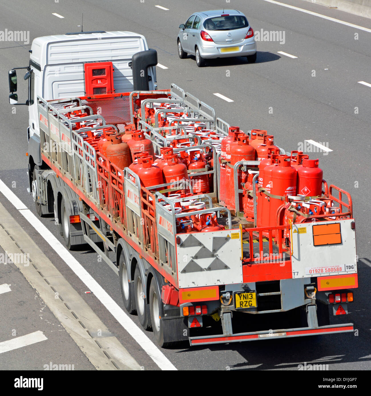 British Oxygen Company BOC trailer loaded with gas cylinders driving along M25 motorway Essex England UK Stock Photo