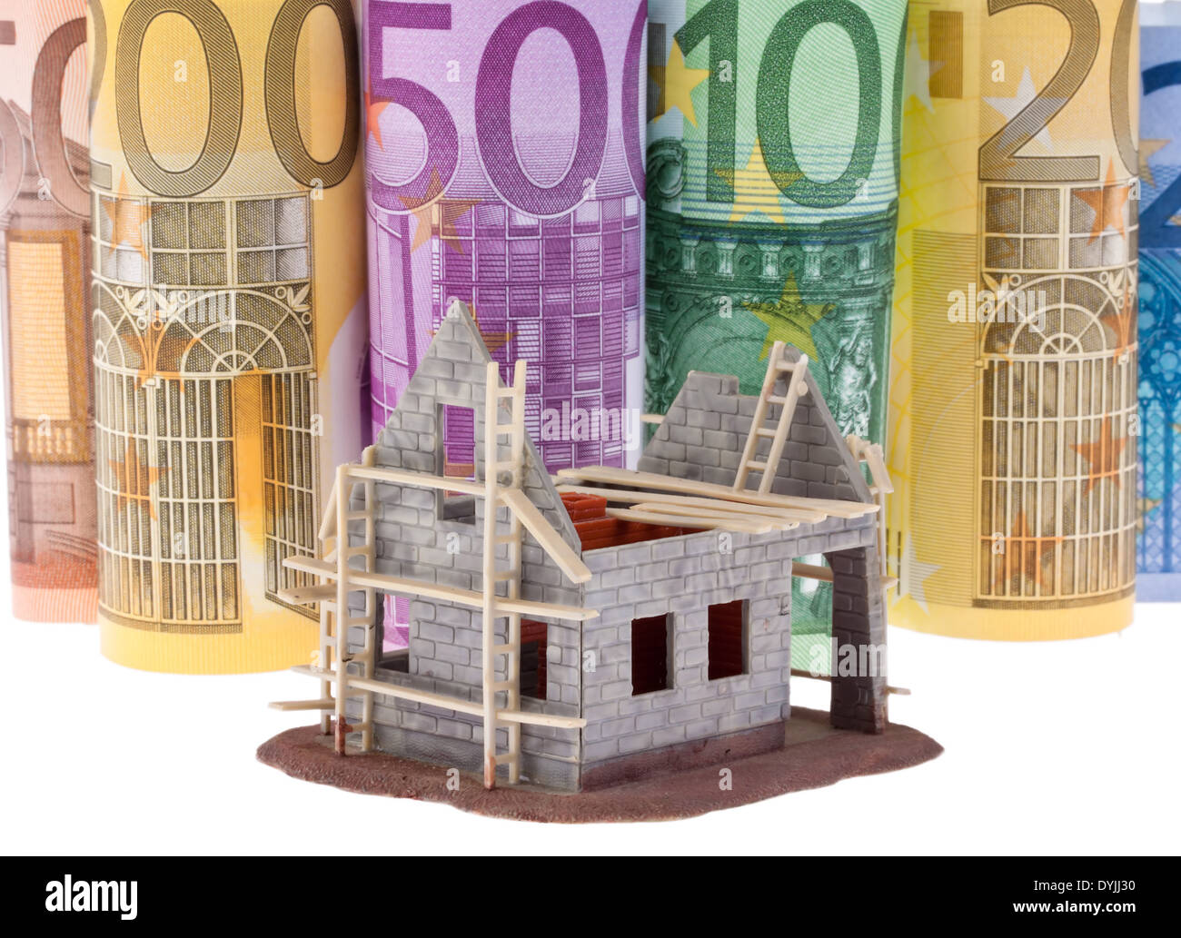 Many Euro banknotes with shell construction house, Viele Euro Geldscheine mit Rohbau Haus Stock Photo