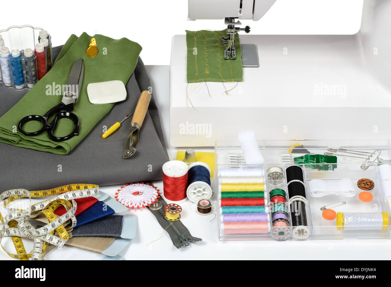 Sewing tailoring dressmaking machine utensils table detail Stock Photo