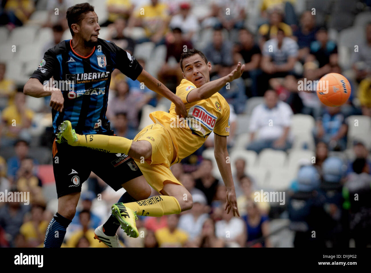 Ciudad De Mexico, Mexico. 19th Apr, 2014. America's Paul Aguilar (R) vies for the ball with Queretaro's Yasser Corona during their match of the MX League Closing Tournament held at Azteca Stadium in Mexico City, capital of Mexico, on April 19, 2014. © Alejandro Ayala/Xinhua/Alamy Live News Stock Photo