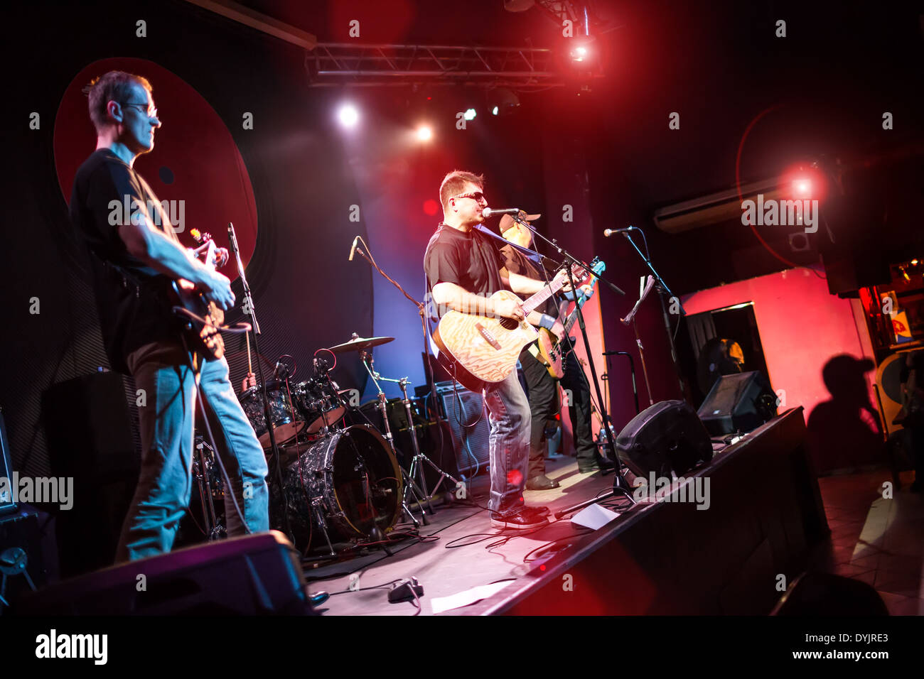 Band performs on stage, rock music concert in a nightclub Stock Photo