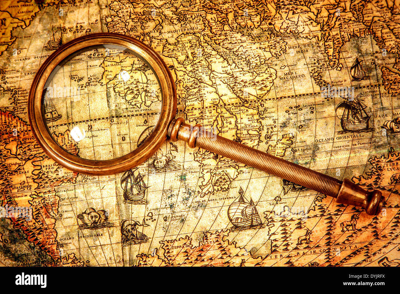 Still Life Map Vintage still life. Vintage magnifying glass lies on an ancient world ...