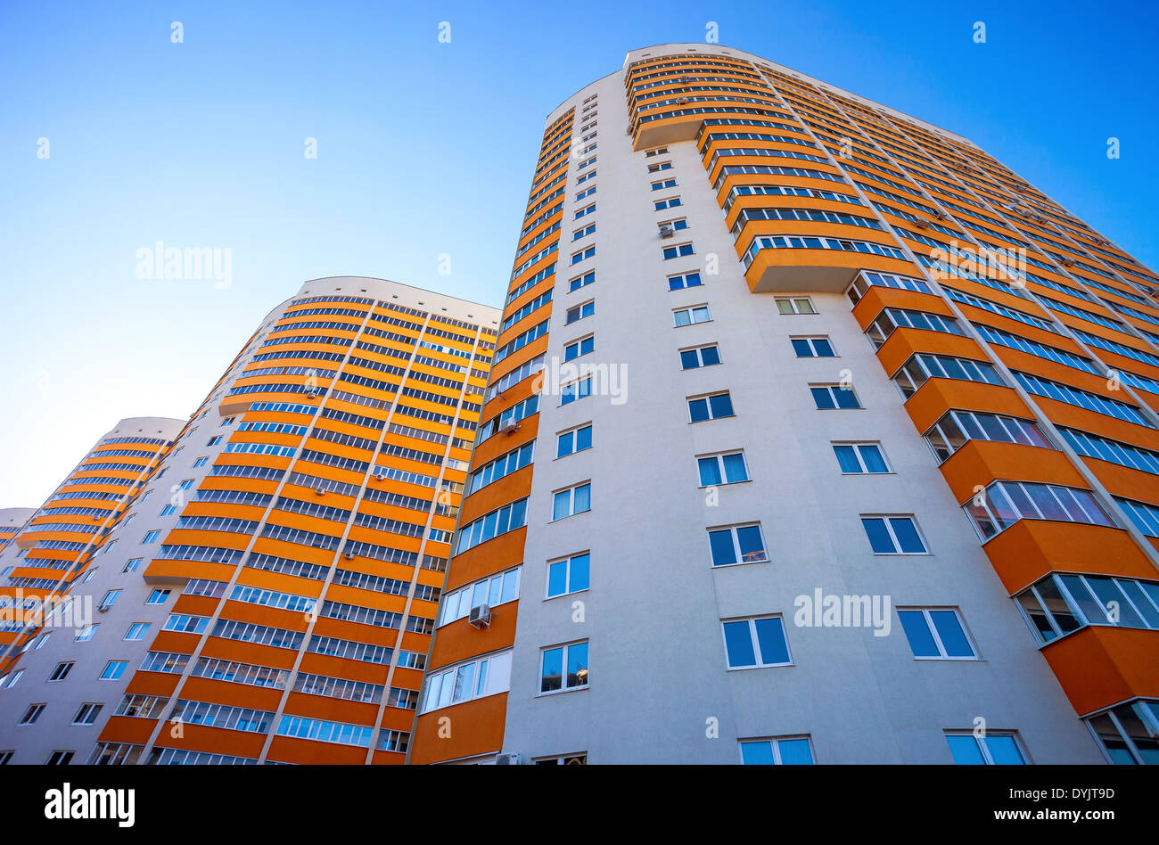 Tall apartment buildings on blue sky background Stock Photo - Alamy