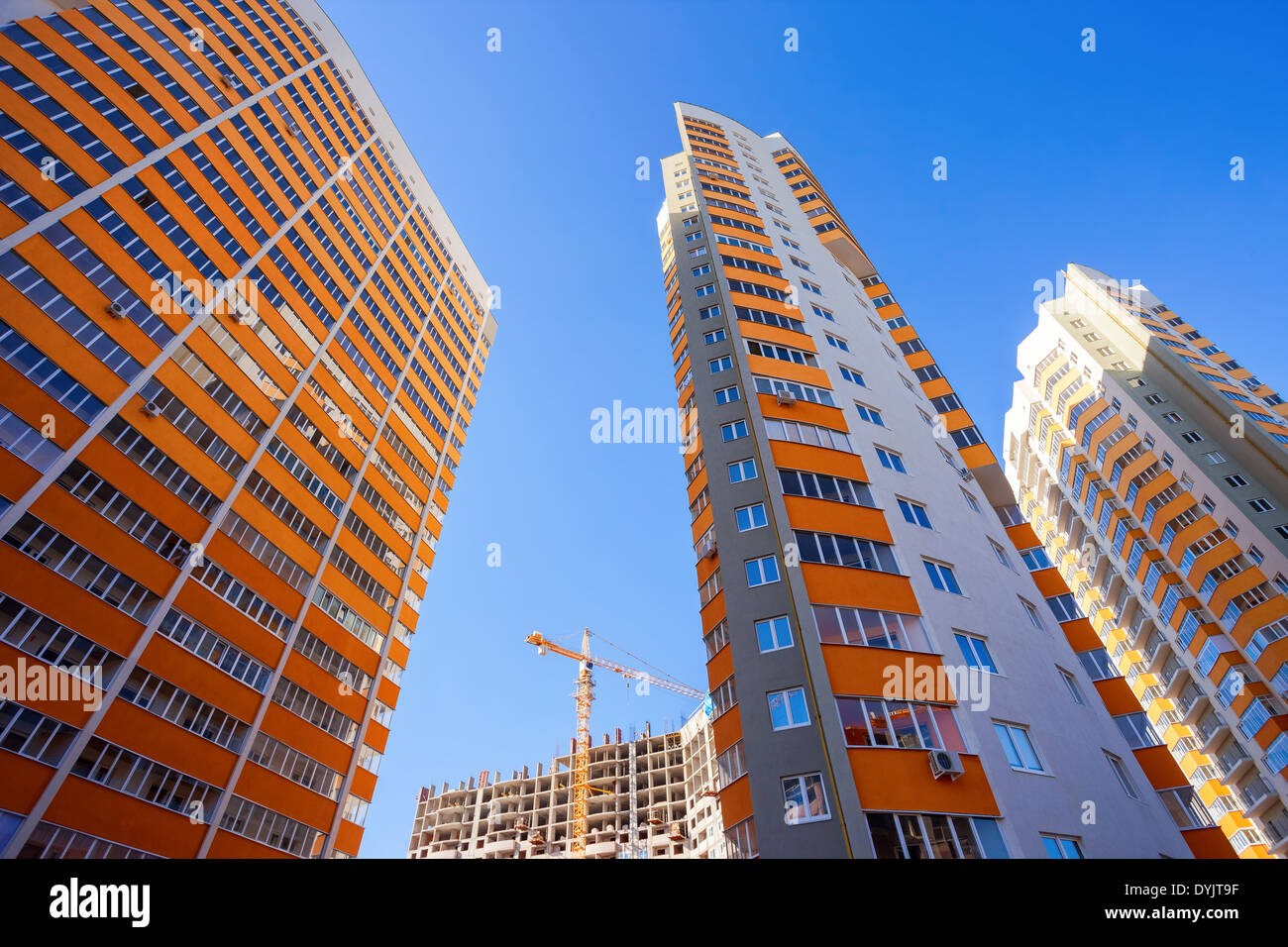 Tall apartment buildings on blue sky background Stock Photo - Alamy
