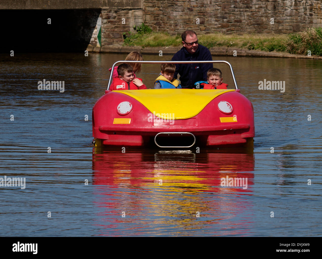 VW beetle car shaped paddle boat, Bude canal, Cornwall, UK Stock Photo