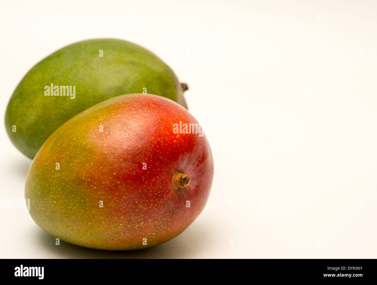 A pair of Mango fruit isolated on a white background Stock Photo
