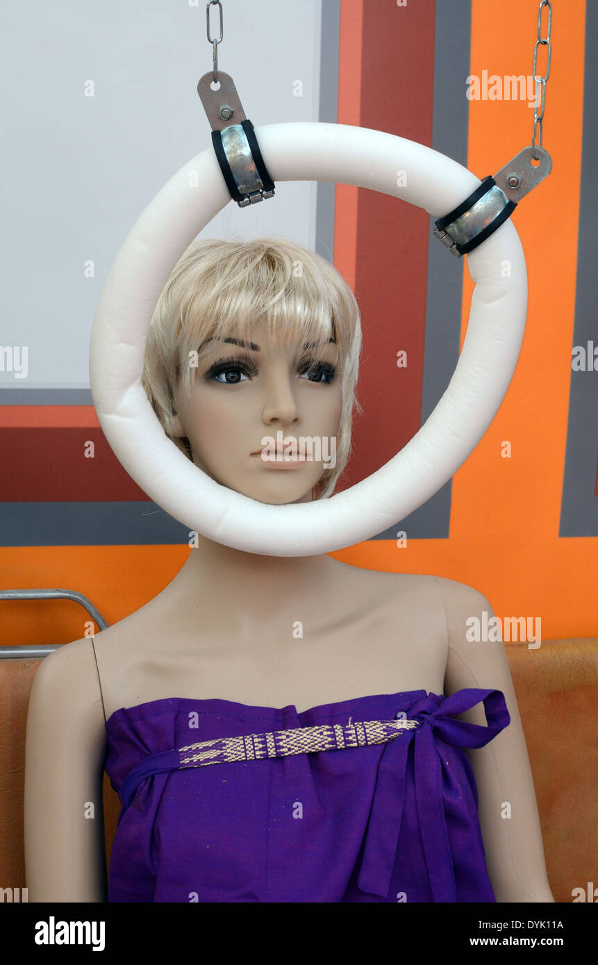 Chin Rest Being Used by Railway Passenger Dummy. A Japanese Chindogu or