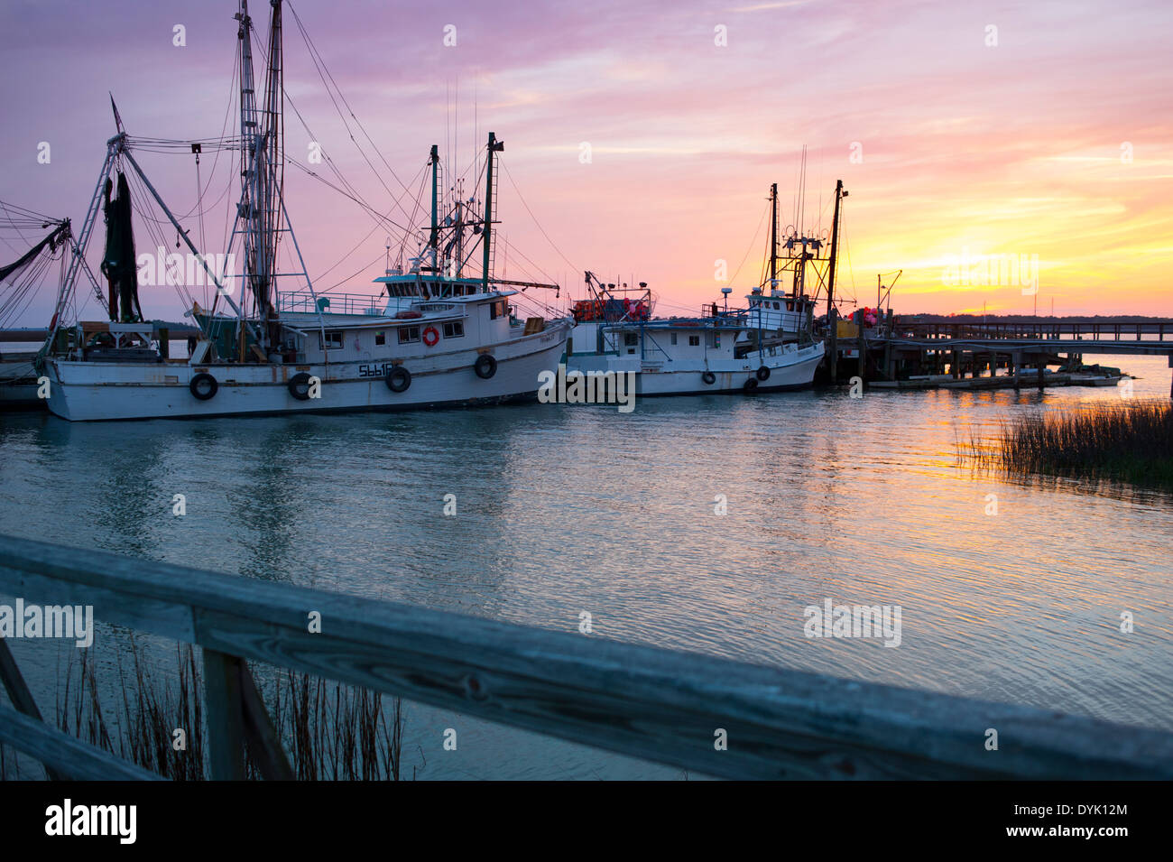 USA South Carolina SC Port Royal - fishing and shrimp boats at the dock at sunset Stock Photo