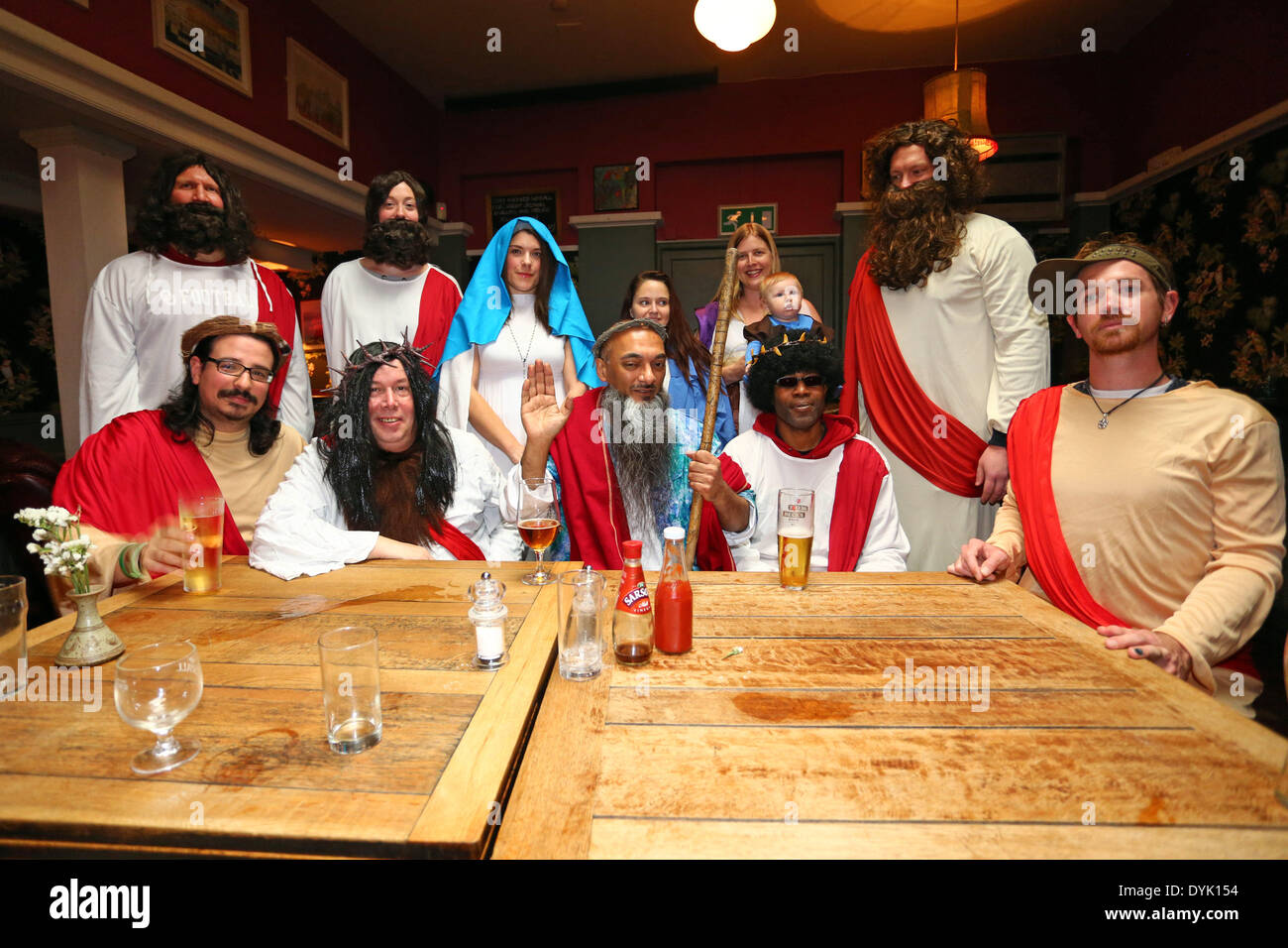 London, UK. 20th April 2014. Participants dressed as Jesus Christ in the annual Easter Sunday Christathon 2014 pub crawl, London, England. The pub crawl moves between London pubs with names associated with biblical themes or characters and started at the Trinity Pub near London Bridge, moving on to the St Christopher Inn before heading into Central London. Credit:  Paul Brown/Alamy Live News Stock Photo