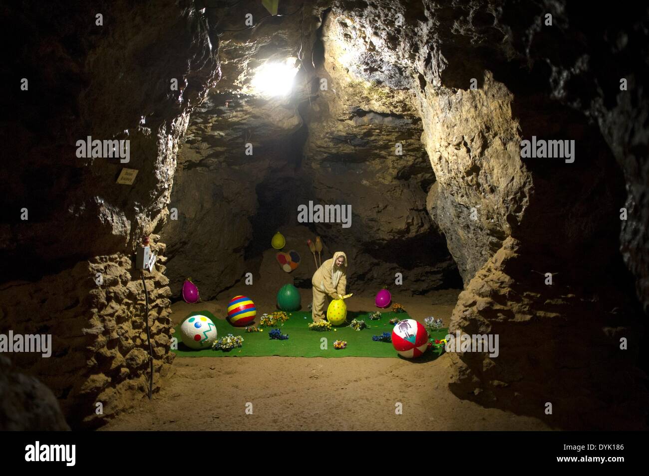 Ennepetal, Germany. 20th Apr, 2014. A woman dressed up as 'Easter bunny Lilly' prepares the Easter decoration for the next guided tour through the Kluterthoehle cave in Ennepetal, Germany, 20 April 2014. During the tour wizzard Abraxus will help Easter bunny Lilly and the attending children to recover vanished Easter eggs for the Easter celebrations. The Kluterthoehle cave was regarded to be the biggest cave in Germany until 1959. Today it is mainly used as a spa for asthmatics. Photo: JONAS GUETTLER/dpa/Alamy Live News Stock Photo