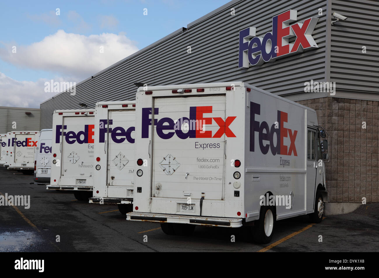 Federal Express delivery trucks parked outside FedEx terminal at Ottawa Airport, Canada, YOW, April 19, 2014 Stock Photo
