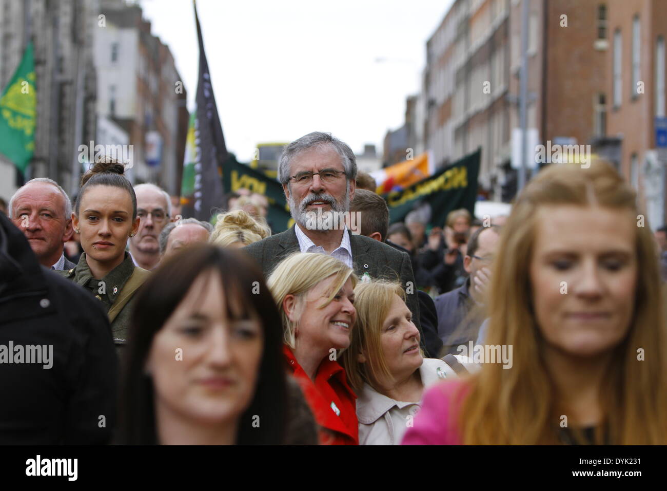 Dublin, Ireland. 20th April 2014. Sinn Fein president Gerry Adams walks in the middle of the crowd at the commemoration march. Sinn Fein president Gerry Adams led the Sinn Fein commemoration of the 98th anniversary of the Easter Rising of 1916. The party supporters marched from the Garden of Remembrance to the General Post office (GPO) for a rally. Credit:  Michael Debets/Alamy Live News Stock Photo