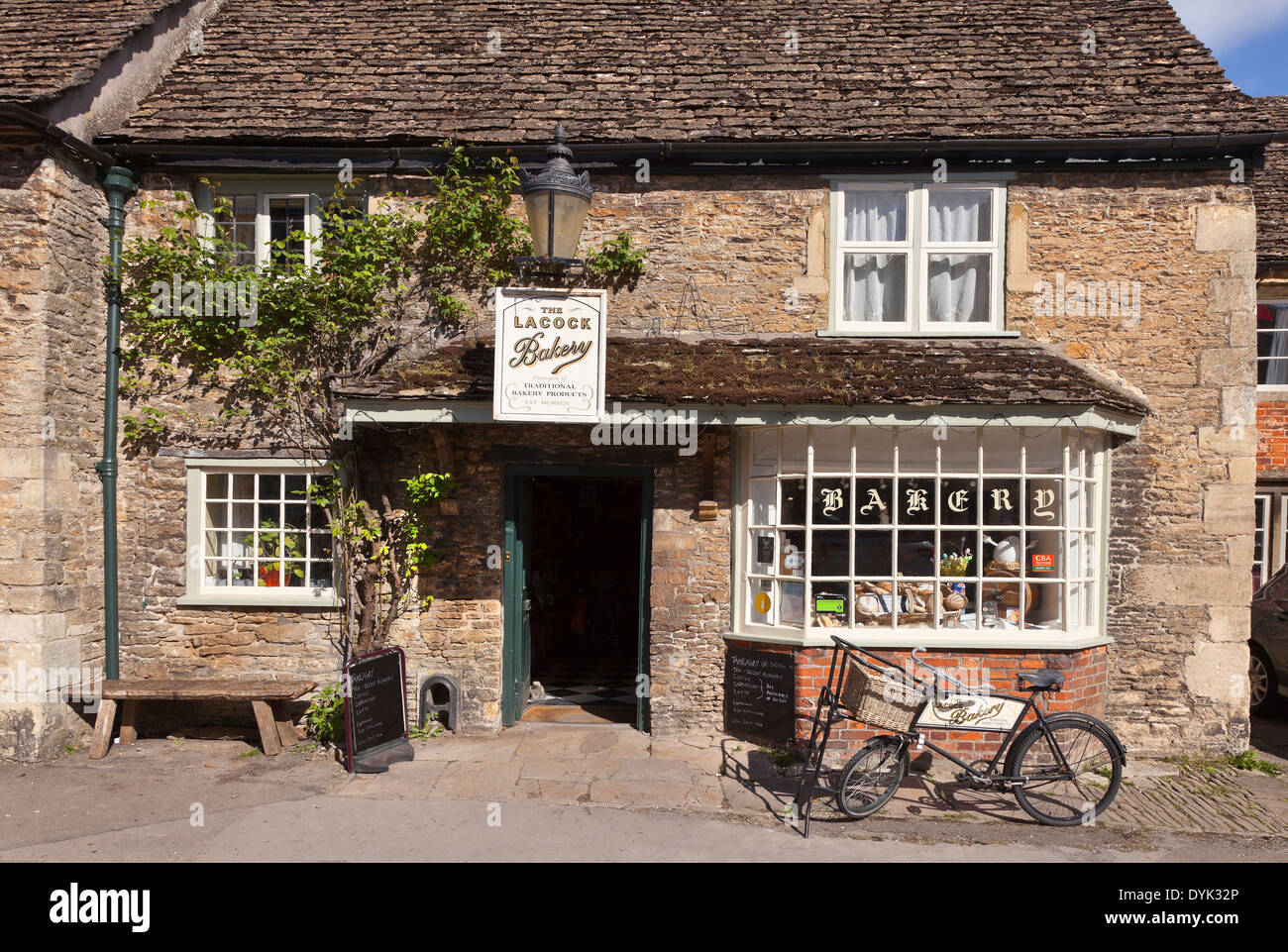 Lacock village, Wiltshire, UK. Traditional cottages. sunny day, blue sky Stock Photo