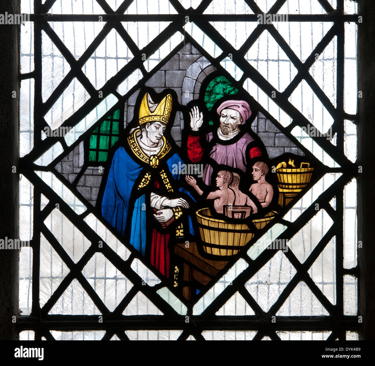 Saint Nicholas saving three boys from a barrel stained glass, St. Nicholas Church, Little Horwood, Buckinghamshire, England, UK Stock Photo
