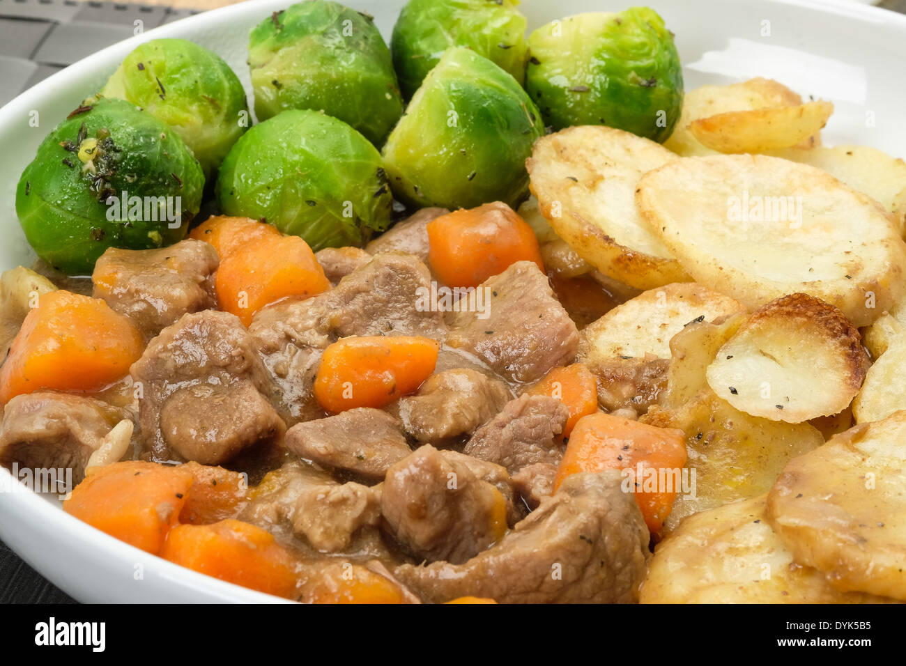 Traditional Lancashire hotpot close-up, made with chunks of lamb or mutton and casseroled with carrots and onion in  tasty gravy Stock Photo
