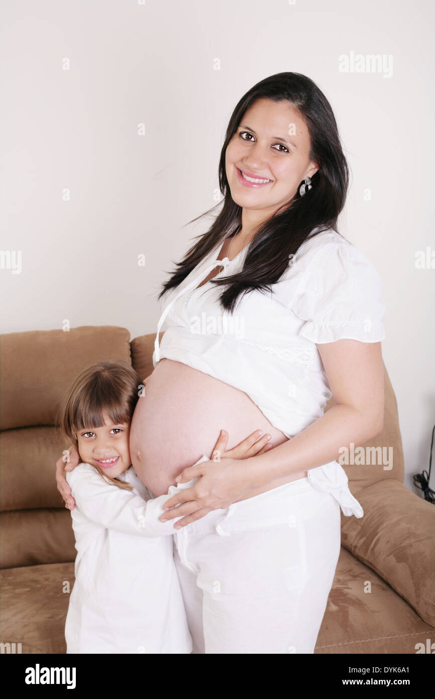 Portrait of Pregnant woman with her daughter Stock Photo