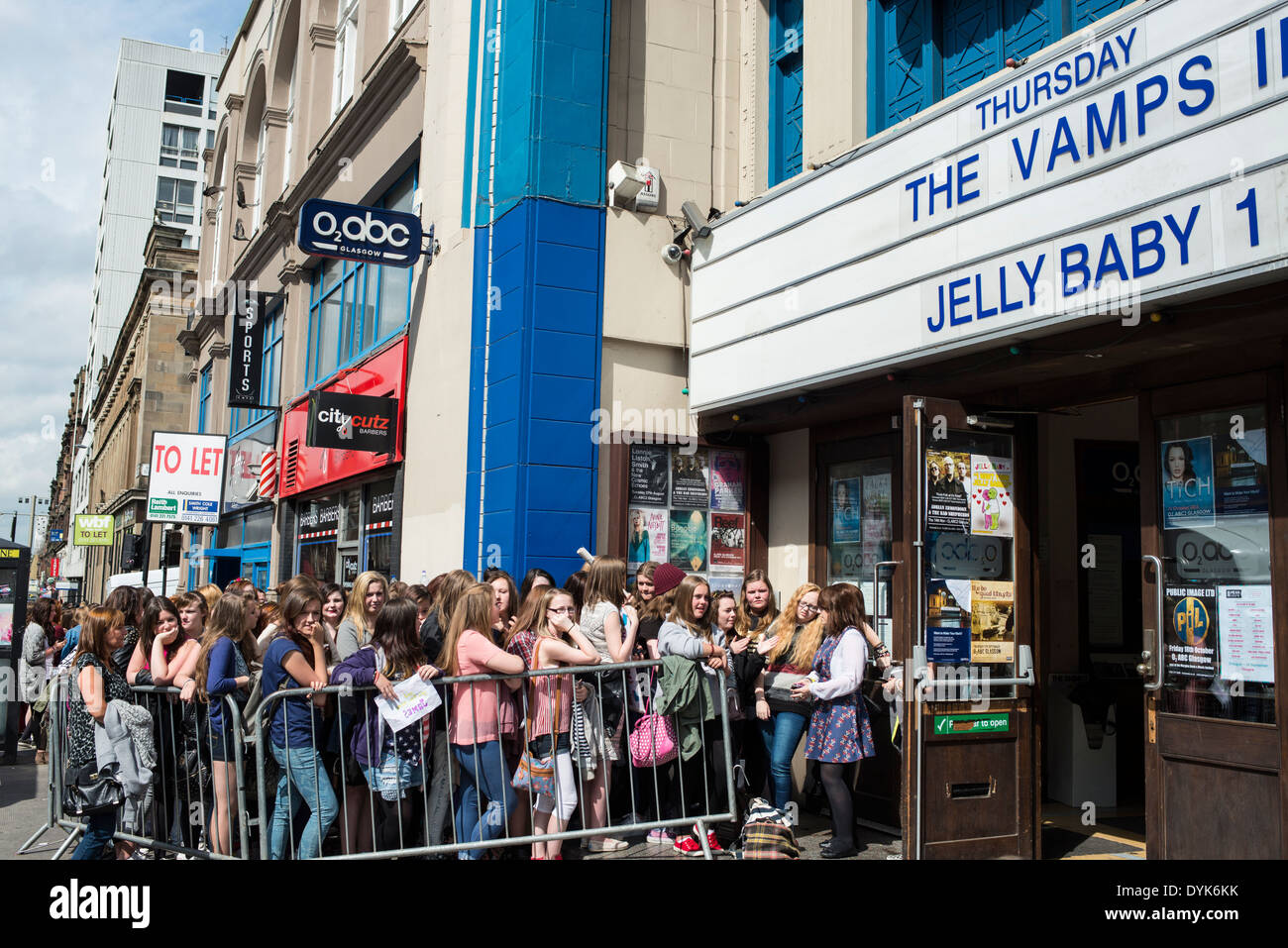 Teenage girls line up for a boy band performance, Glasgow Stock Photo