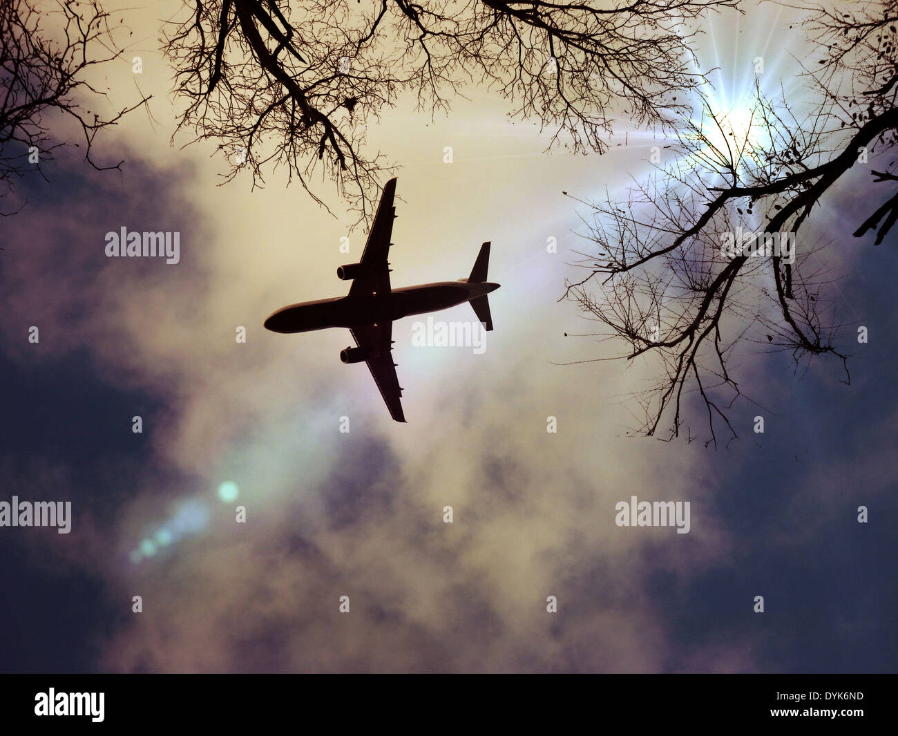 Airplane Flying in Dark Stormy Clouds Stock Photo - Alamy
