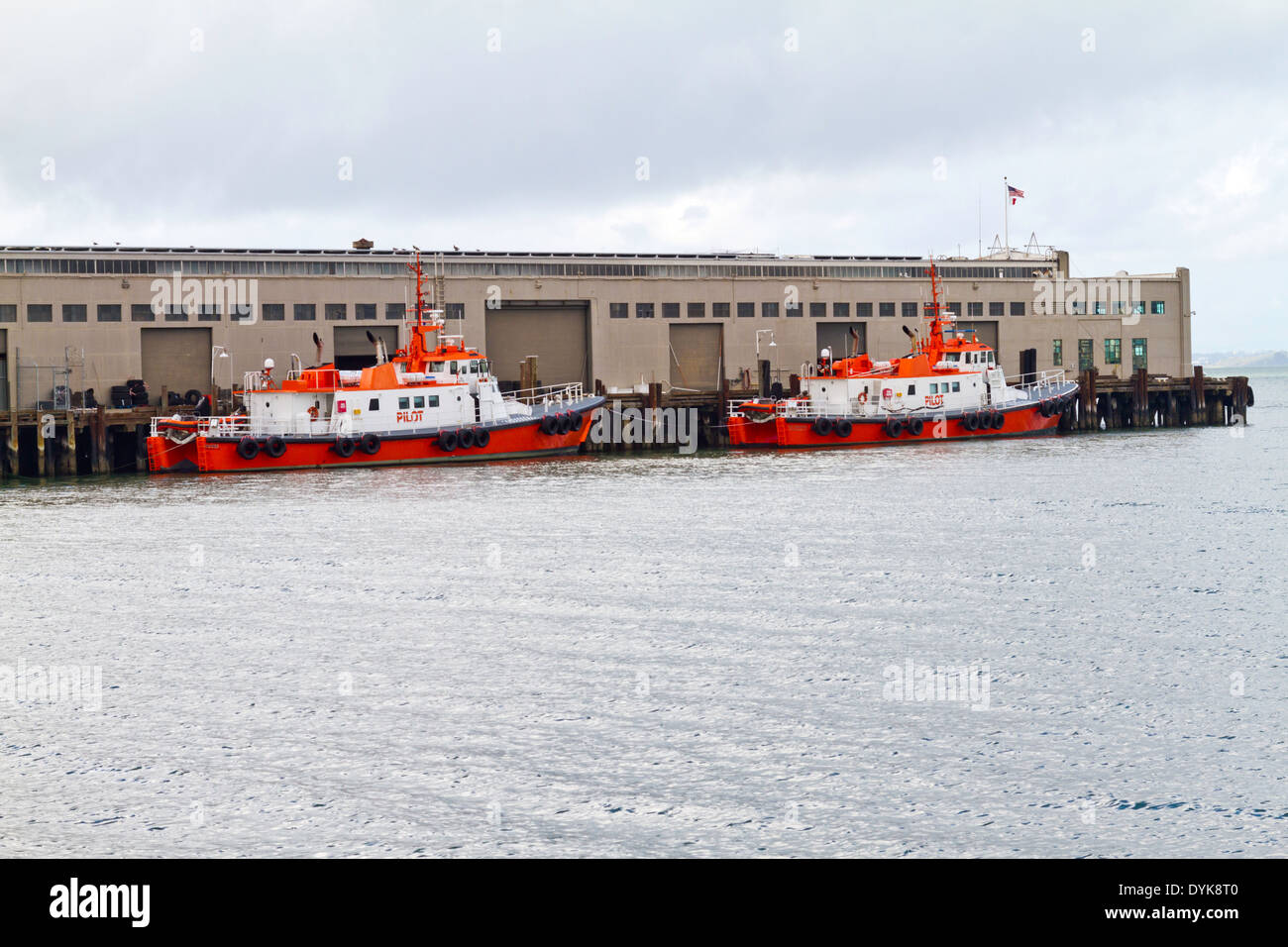 Two pilot boats docked at a pier in San Francisco Bay. Stock Photo