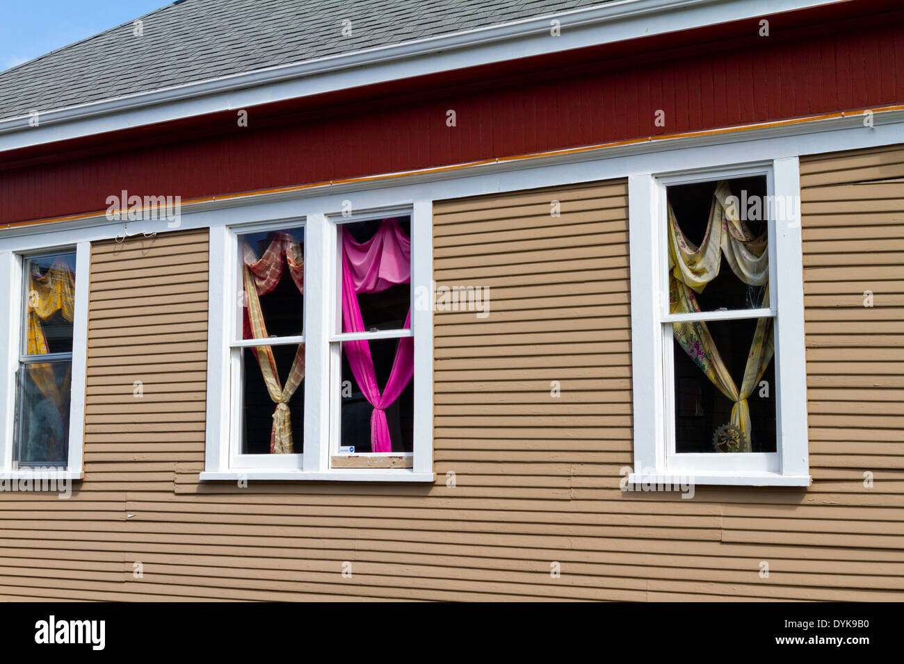 Colorful Draperies Seen In The Windows Of A Shop In Half Moon Bay