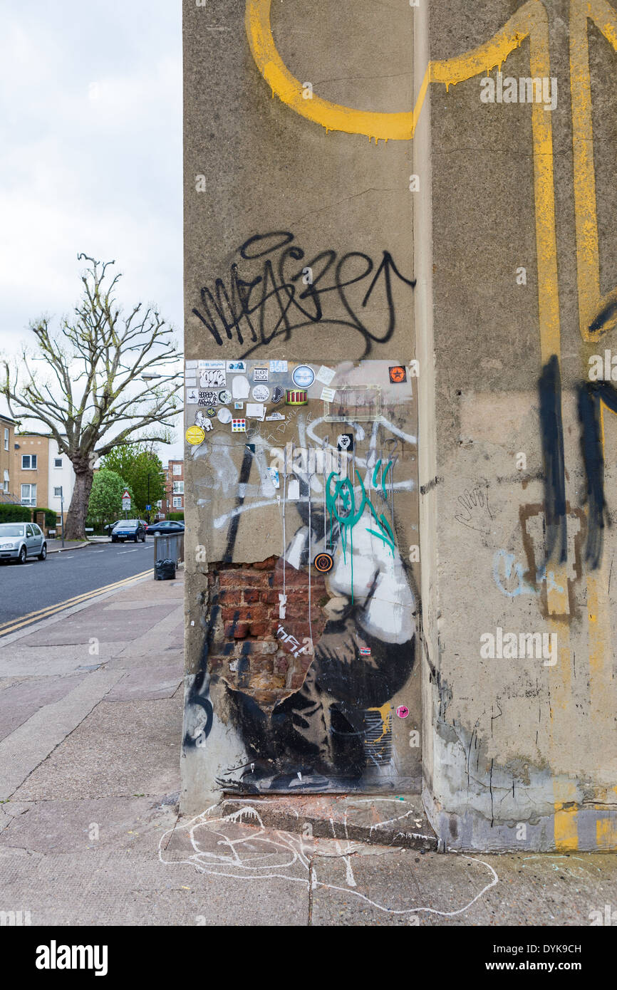 Banksy's Yellow Lines Flower Painter in Bethnal Green is in a state of disrepair Stock Photo