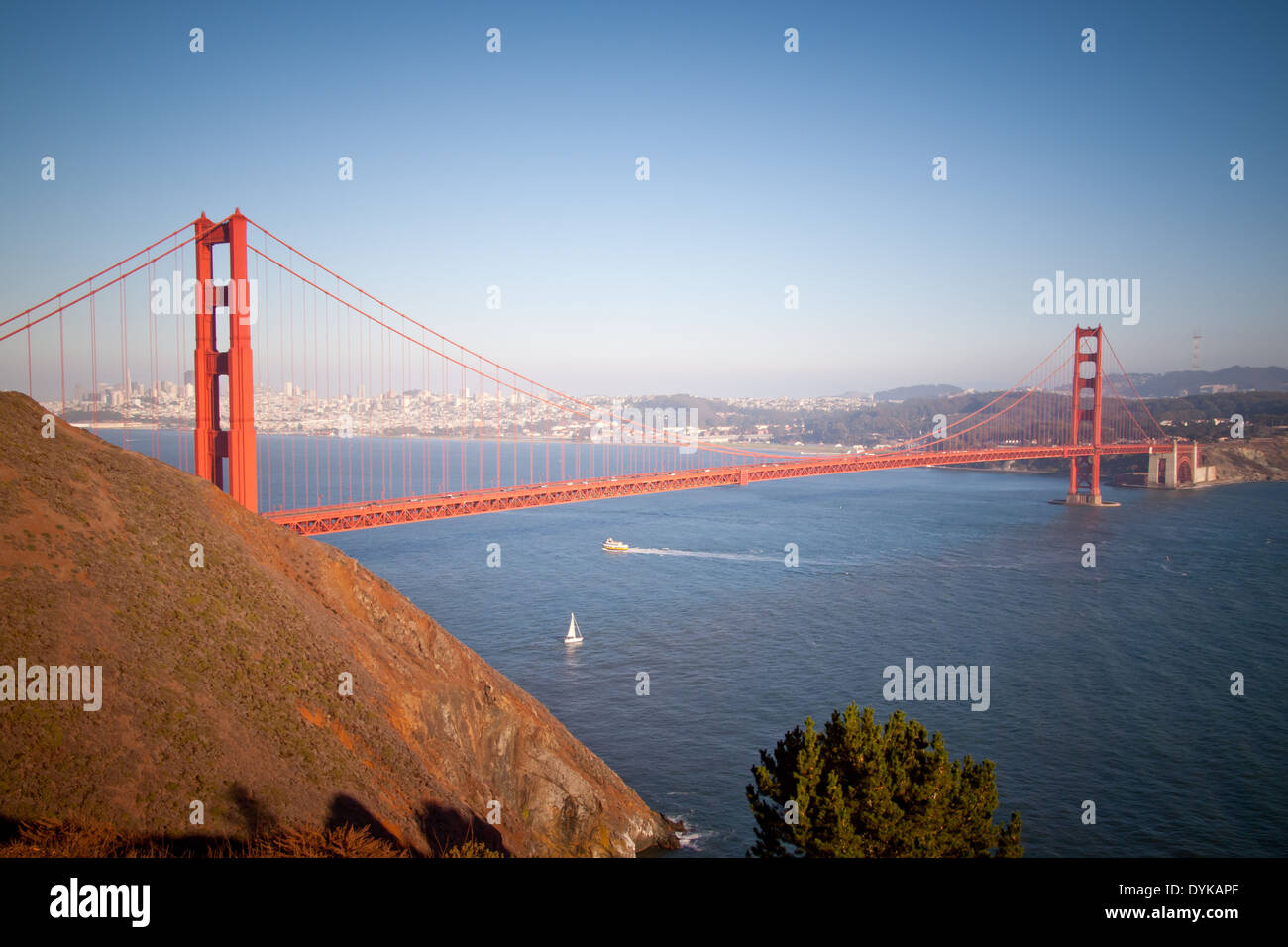 An aerial view of the Golden Gate Bridge as seen from Marin County, California.  San Francisco is in the distance. Stock Photo
