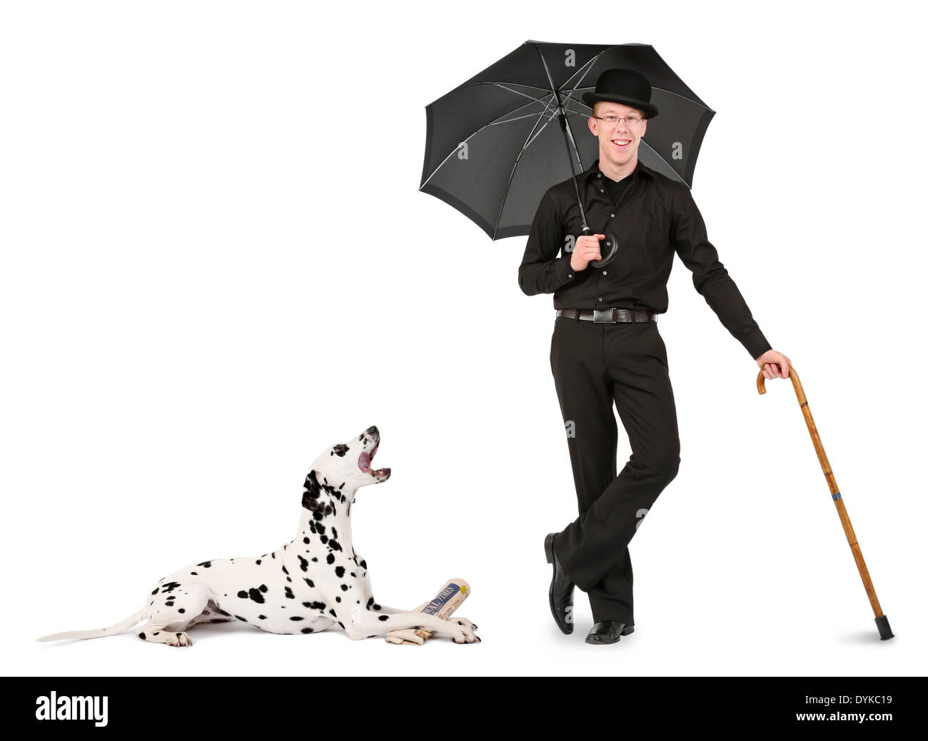 junger Mann mit Melone, Regenschirm und Gehstock, young man with bowler hat, umbrella and walking stick, Mann mit Dalmatiner; Sc Stock Photo
