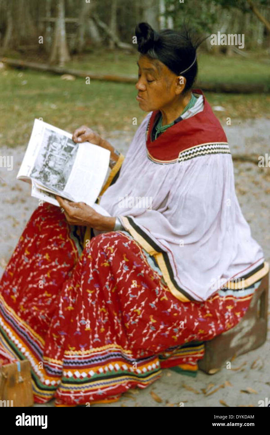 Seminole woman reading at Big Cypress Reservaton Stock Photo